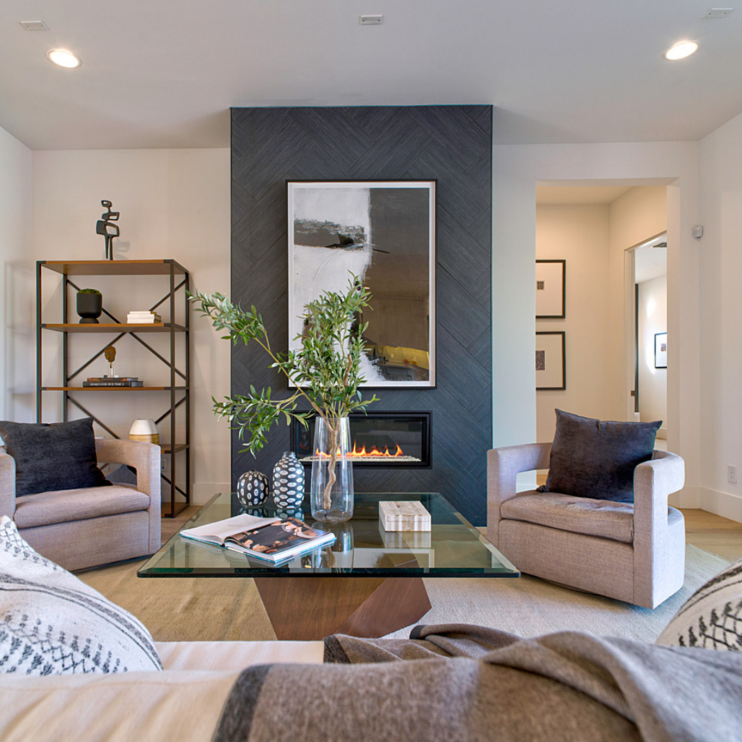 Luxury open concept living room with gray tile surround.