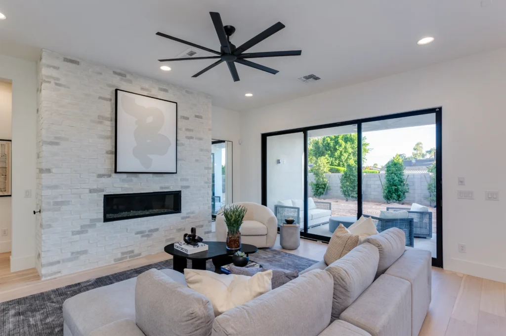 Arcadia Lite Farmhouse Style living room with fireplace, sliding glass doors