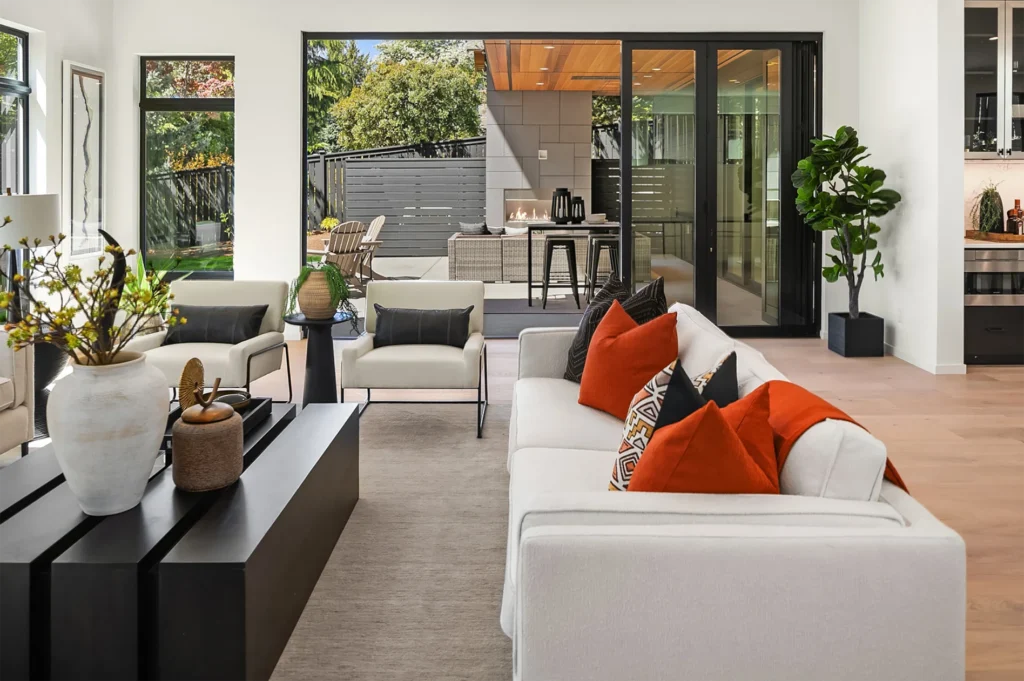 Bellevue Modern Style Home family room with large sliding glass doors to patio