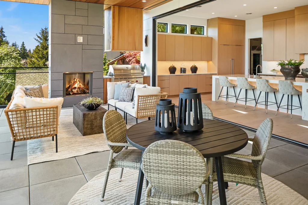 Bellevue Modern Style indoor/outdoor patio and kitchen with a fireplace