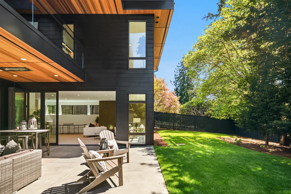 Bellevue Modern Style Home Back yard with partially covered patio