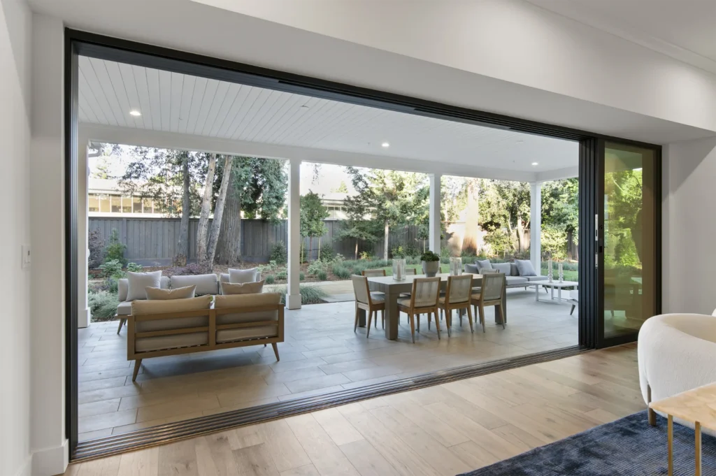 Atherton Single Story Farmhouse walk-out indoor-outdoor patio