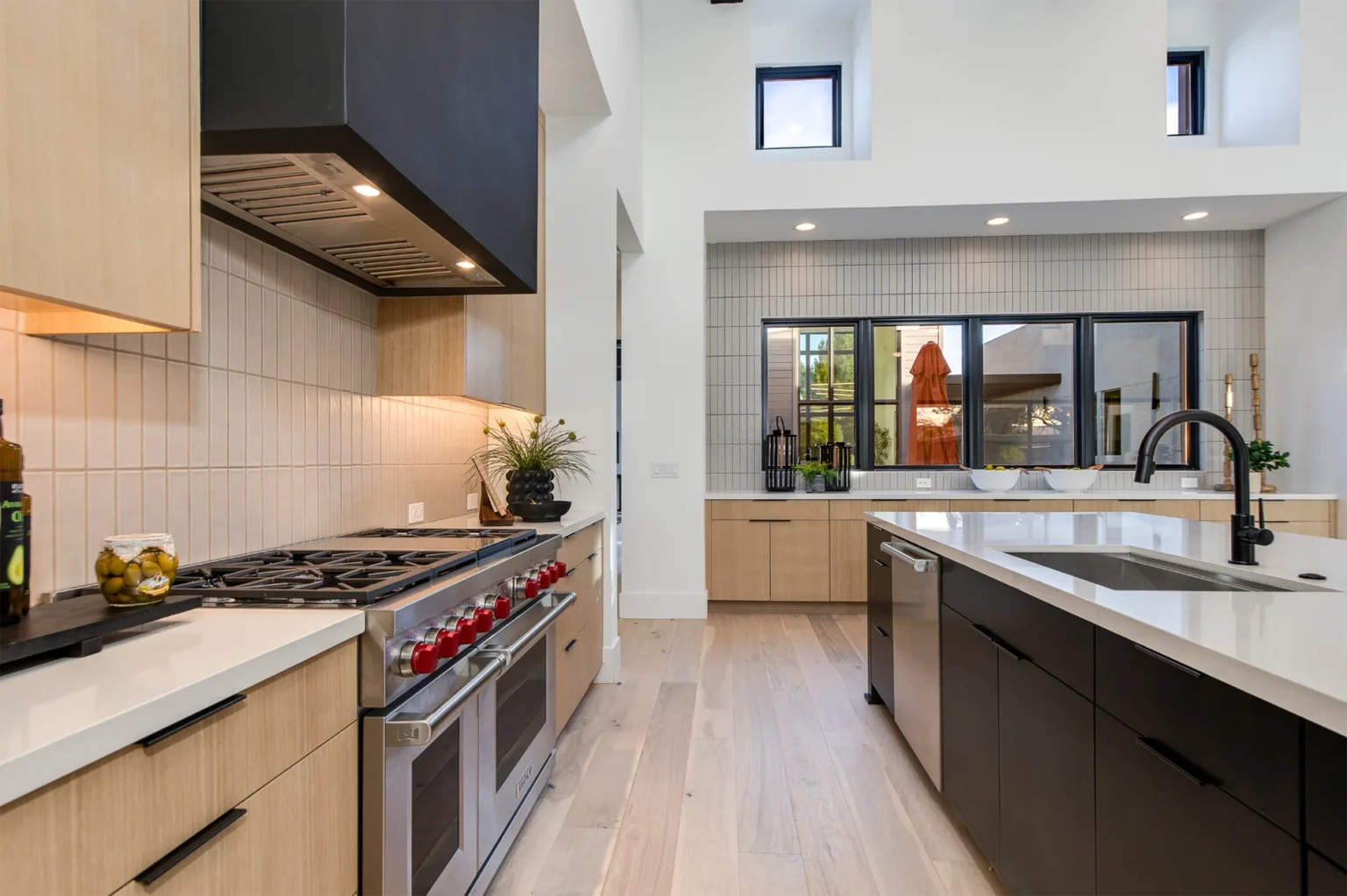 Phoenix Modern Style Home Kitchen island, gas range, marble counters