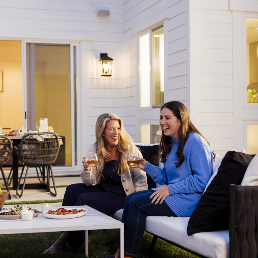 Mother and daughter enjoy time together in backyard