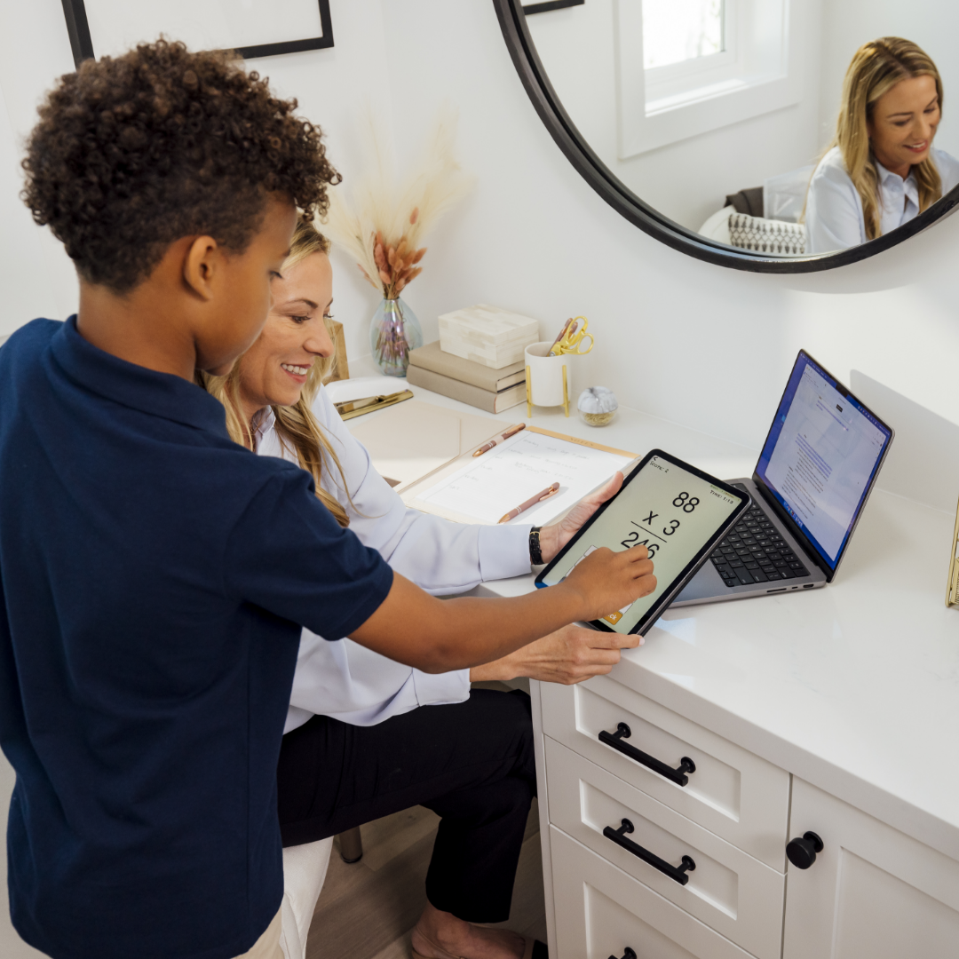 Mother helps her son with homework in her built-in workspace