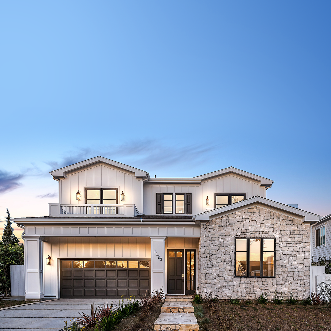 Exterior image of transitional-style TJH home with white siding + stone masonry