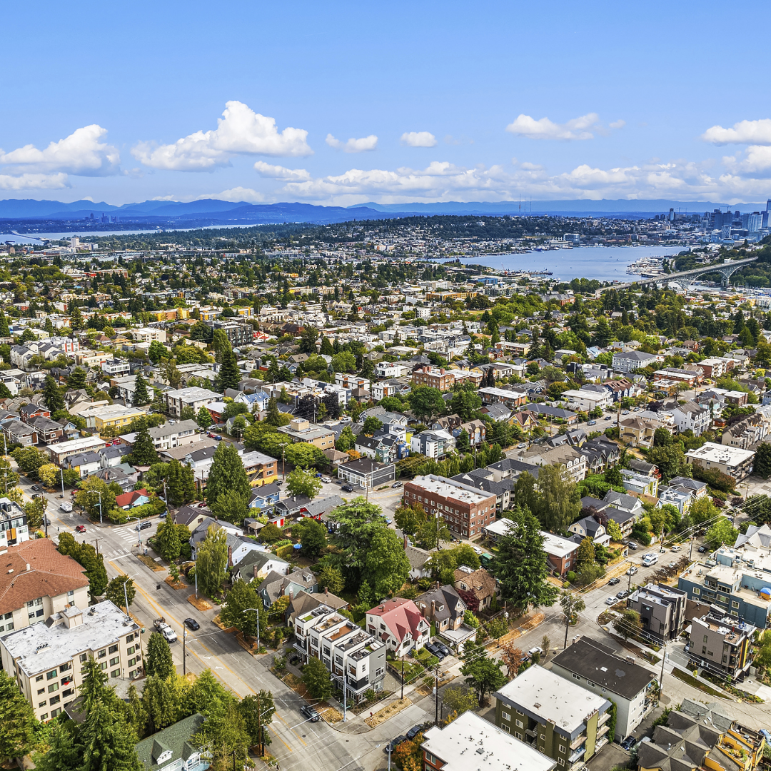 Aerial image with blue sky and waterfront visible in PNW neighborhood of Fremont