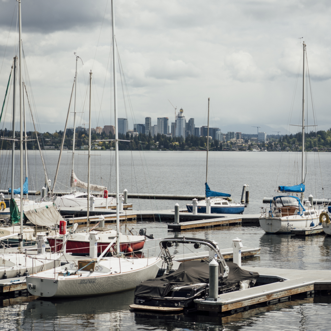 Image of Pacific Northwest dock and boats at the waterfront with Seattle in the background