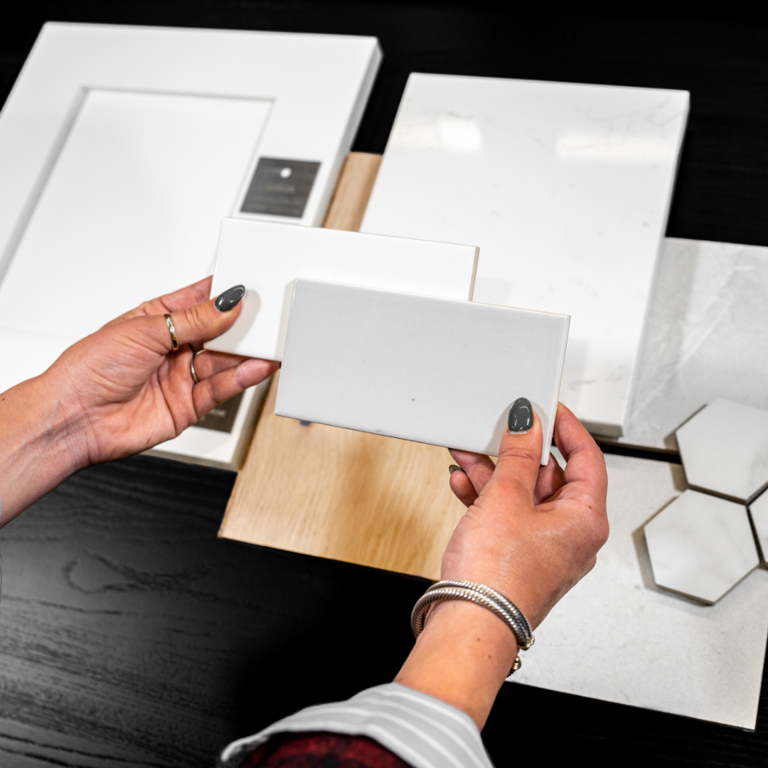 Image of TJH designer holding material selects for kitchen design