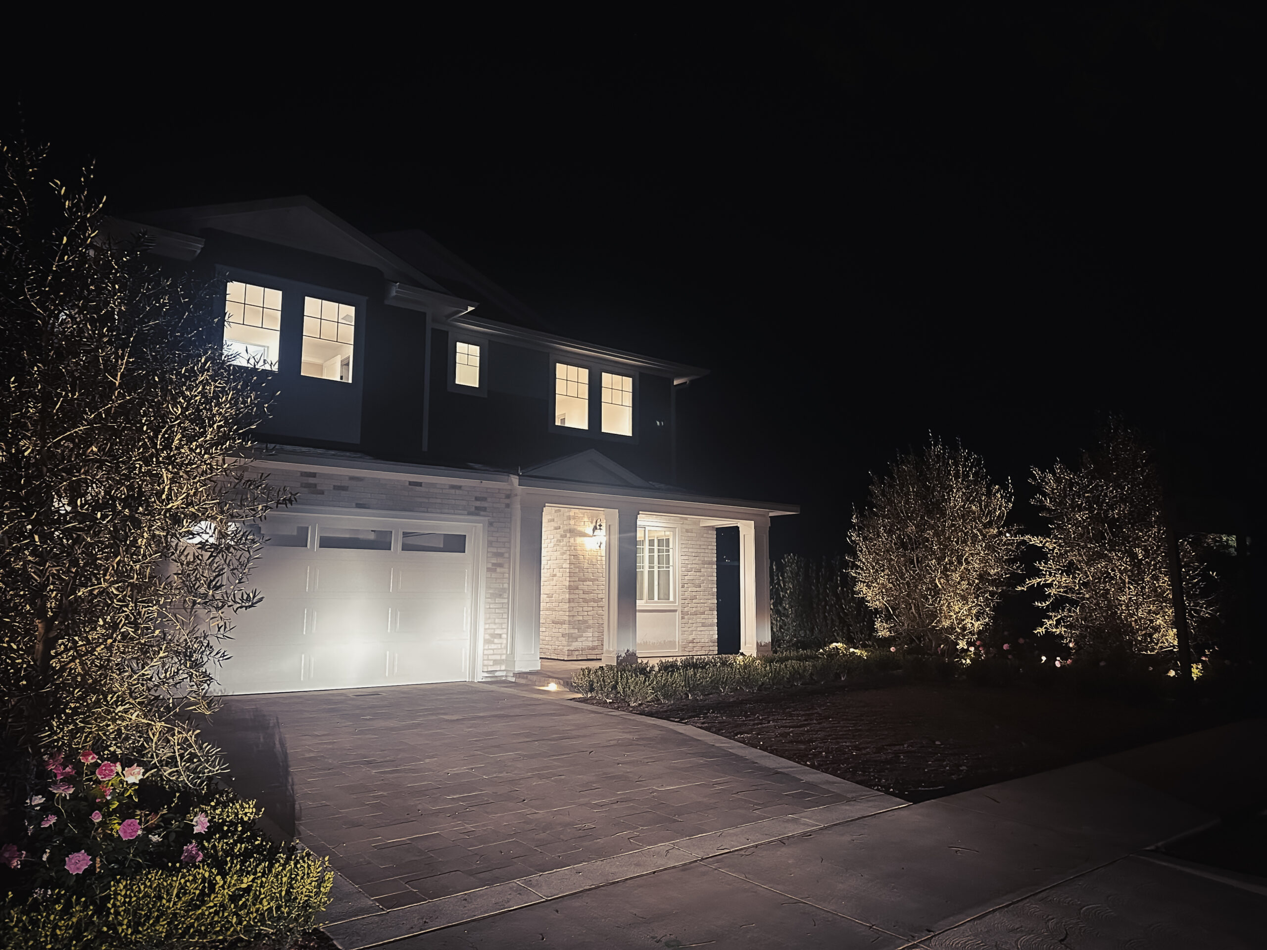 Pacific Palisades rebuild milestone completed home at night following wildfire recovery