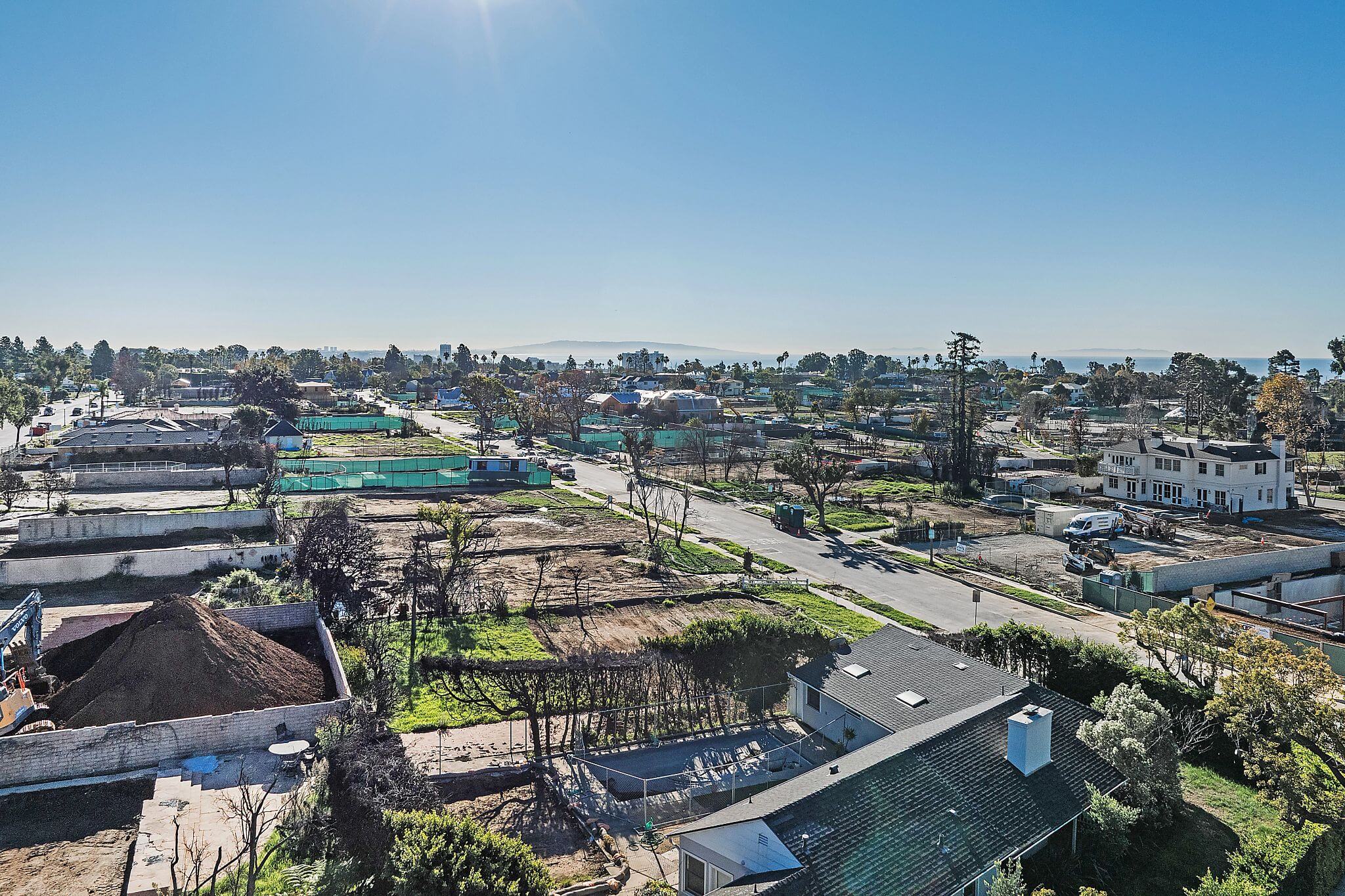 Pacific Palisades wildfire recovery aerial view of coastal neighborhood rebuilding after Los Angeles fires