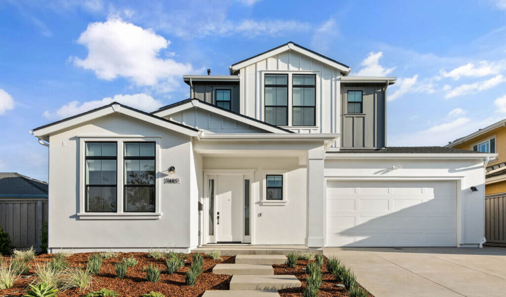 TJH Hackberry two-story exterior in Northern California with white siding, large windows, double garage, and landscaped front yard