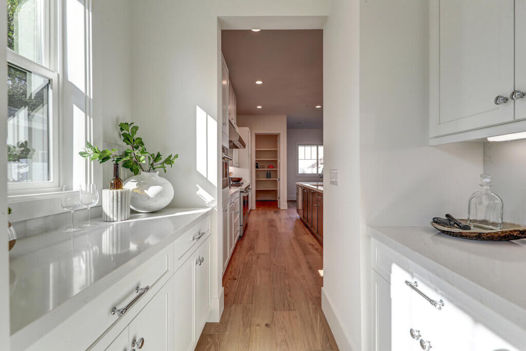 TJH Willow kitchen in Southern California featuring marble countertops and a bright, modern aesthetic.