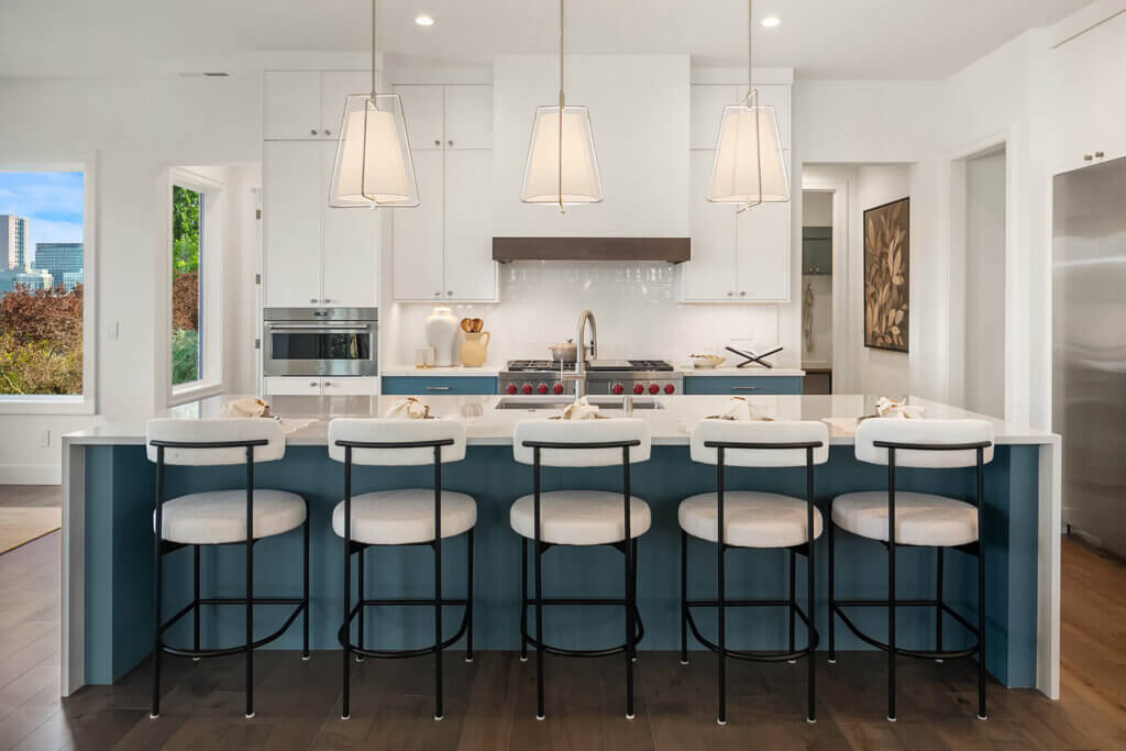 TJH home kitchen in the Pacific Northwest featuring stainless steel appliances and a bright, modern aesthetic.