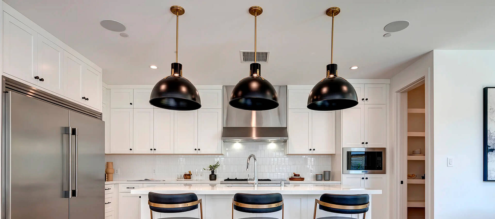 TJH Wisteria kitchen in Southern California featuring stainless steel appliances and a bright, modern aesthetic.